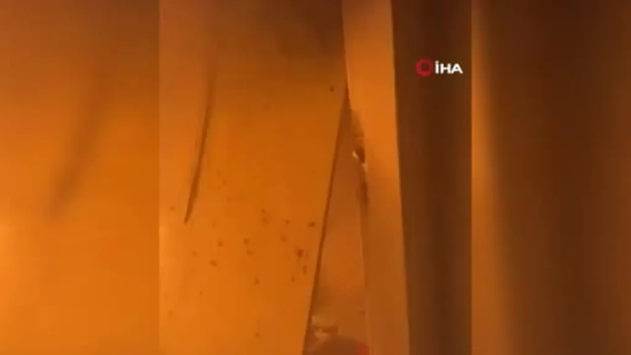 İsrail'in Gazze şehrindeki bir apartmana düzenlediği saldırıda alevler arasında mahsur kalan kız...