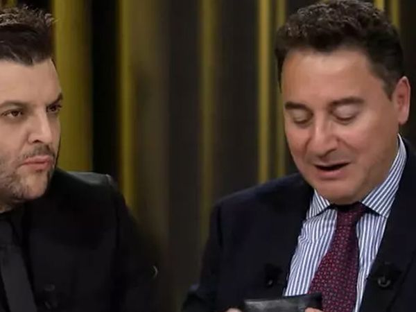 Candaş Tolga Işık'ın programında gergin anlar! Canlı yayında cüzdanını çıkardı