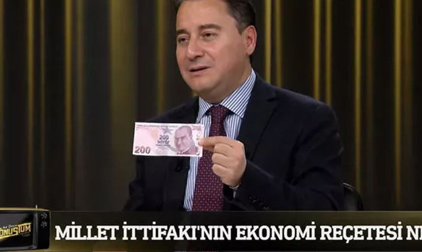 Candaş Tolga Işık'ın programında gergin anlar! Canlı yayında cüzdanını çıkardı