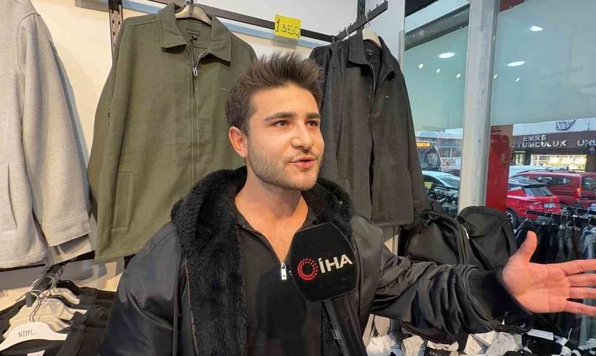 Küçük çocukla mağazaya girip hırsızlık yapan şahıs güvenlik kamerasında